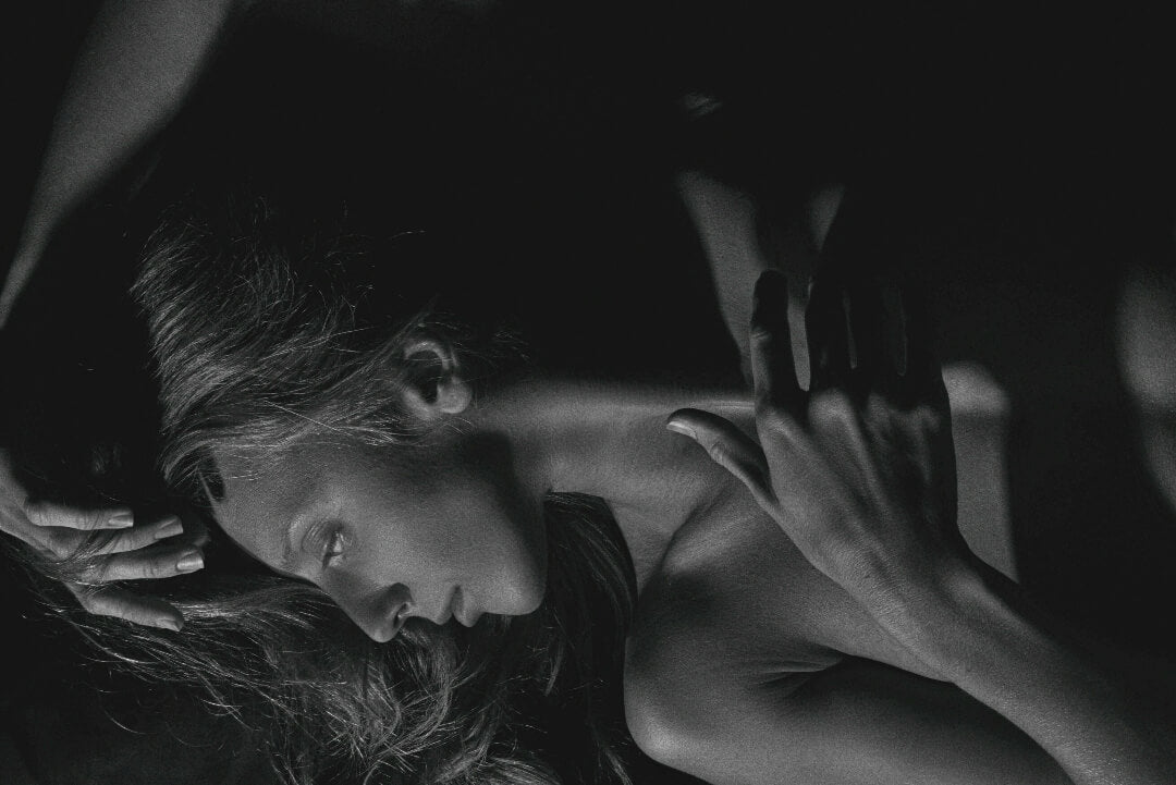 Lacebound sensual black and white photo capturing an intimate mood, featuring delicate lingerie, soft lighting, and evocative composition for an artistic and emotional effect.