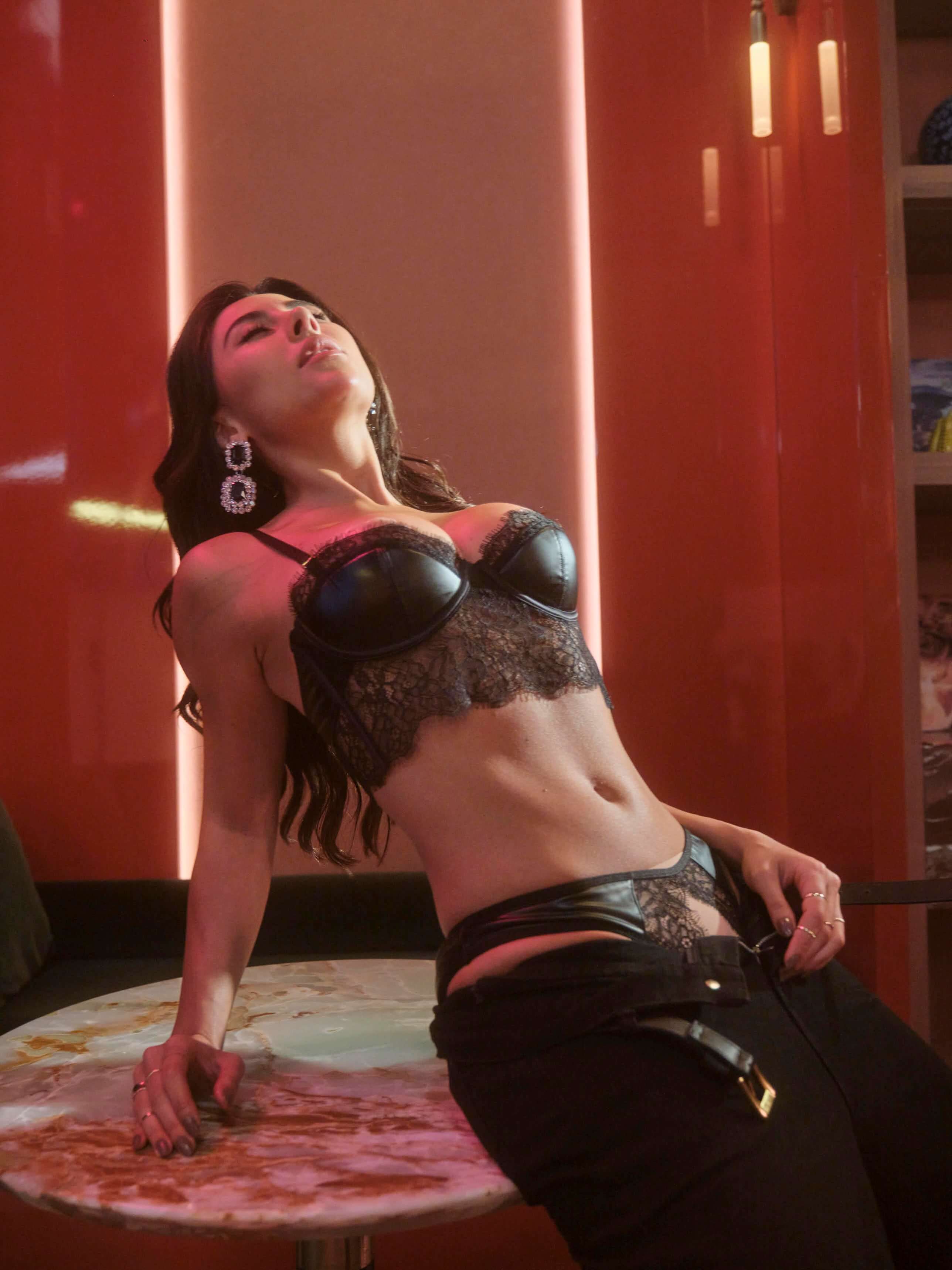 Sexy lace lingerie set featuring crotchless panties and intricate floral lace details in black