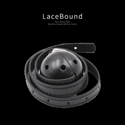 Black adjustable ball gag harness for BDSM, featuring a round black gag and adjustable straps for secure and comfortable fit, perfect for restraint and submissive role play.