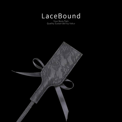 Black feather tickler with soft plume and leather paddle set for sensual BDSM play, combining gentle teasing with firm touch in erotic foreplay.