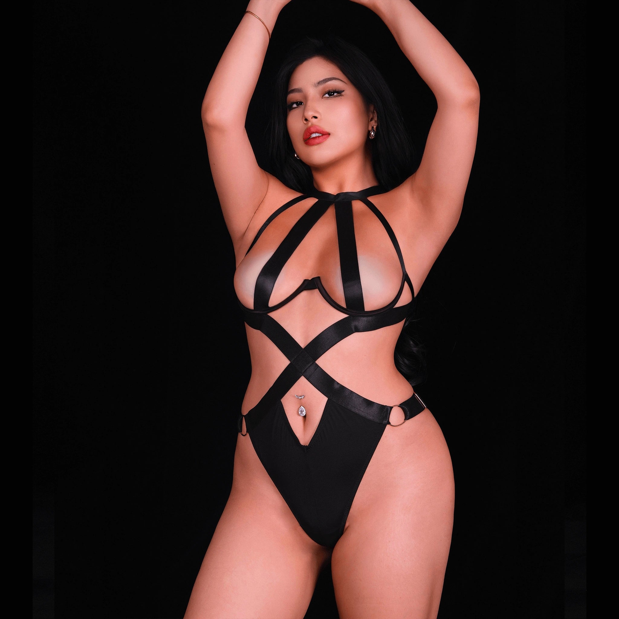 Black strappy lingerie set with geometric strap details, designed for a sleek, edgy, and contemporary lingerie style.