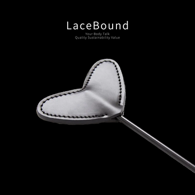 Heart-shaped BDSM whip designed for playful spanking and sensual impact play, featuring a soft faux leather heart tip and durable handle, ideal for flirty and intimate BDSM experiences.