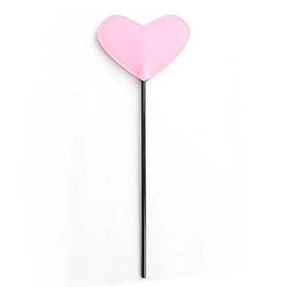 Heart-shaped BDSM whip playful spanking toy, featuring a soft faux leather heart tip and sturdy handle, ideal for gentle teasing and playful impact play.