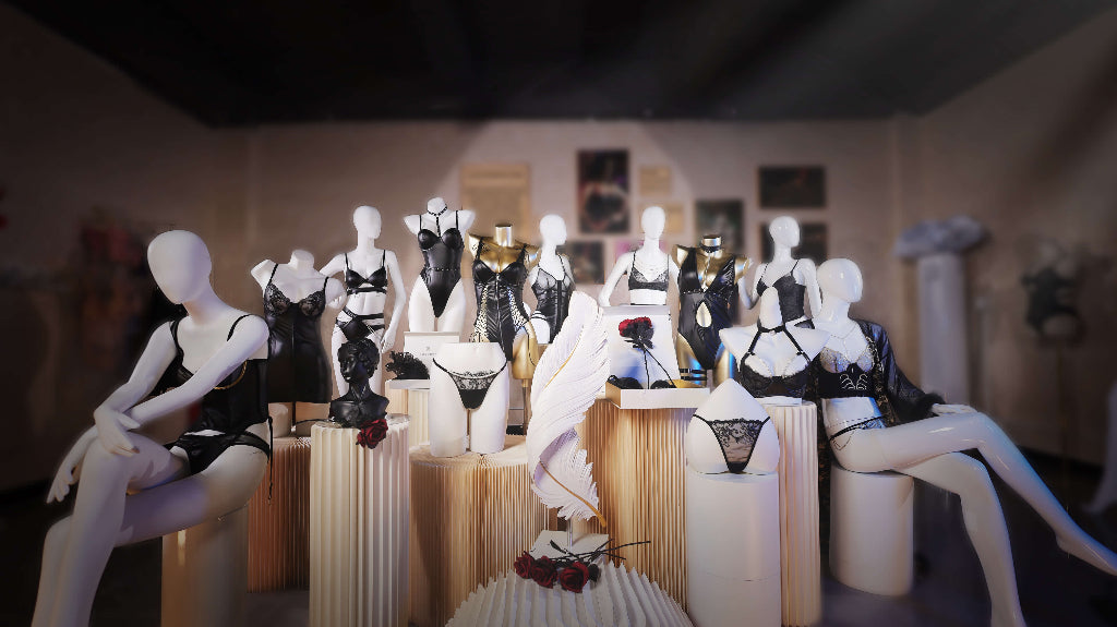 Lacebound black lingerie collection elegantly displayed on mannequins, featuring delicate lace, intricate designs, and sophisticated silhouettes in a boutique setting.