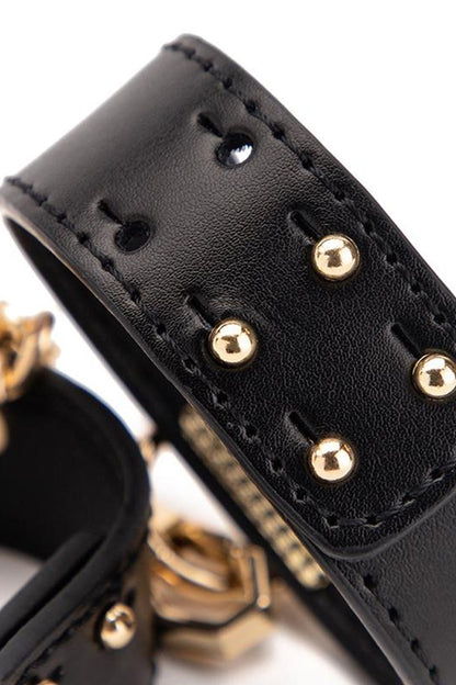 Luxury BDSM all-in-one bondage kit with premium leather restraints, collar, blindfold, and whip, designed for secure, sophisticated, and versatile fetish play.