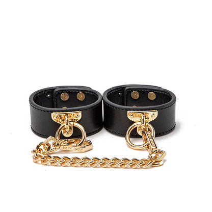 Luxury BDSM all-in-one bondage kit with premium leather restraints, collar, blindfold, and whip for secure, versatile, and elegant fetish play experiences.