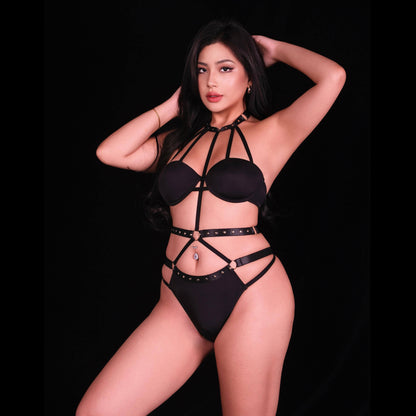 Seductive bondage-inspired black lingerie bodysuit with strappy harness design, adjustable straps, daring cutouts, and form-fitting silhouette for a bold, empowered aesthetic.