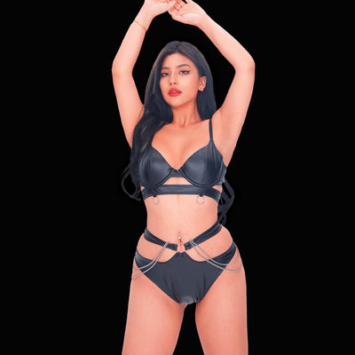 Sexy black leather corset with chain bondage style, designed with distinctive chain embellishments and strong harness accents for a bold, captivating, and edgy lingerie appearance.
