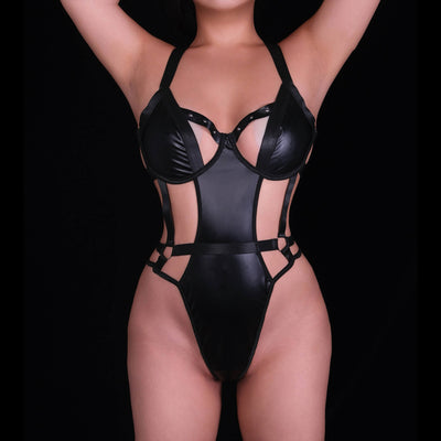 Sexy black strappy bodysuit in a corset-inspired design, detailed with dramatic strap patterns and a sleek, body-contouring fit for a seductive, contemporary, and unforgettable lingerie effect.