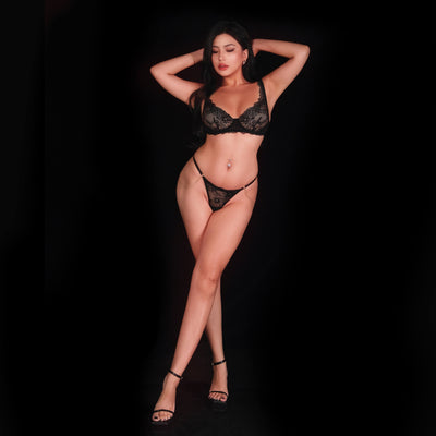 Sexy black lace bra and panty set featuring sheer see-through lace and elegant floral designs, crafted for a seductive, graceful, and feminine lingerie look.